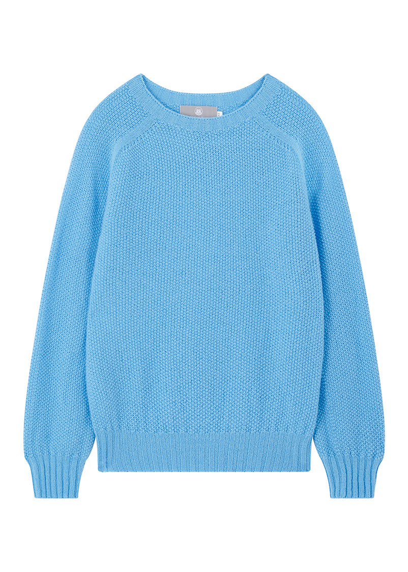 Sky blue moss stitch wool sweater on a white background