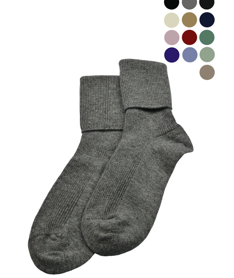 A pair of women's cashmere socks in gray, displayed alongside color swatches indicating available color options including black, ivory, camel, brown, gray, pink, navy blue, lavender, purple, red, and green.