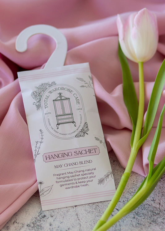 Anti-moth hanging sachet with floral design on a pink fabric background