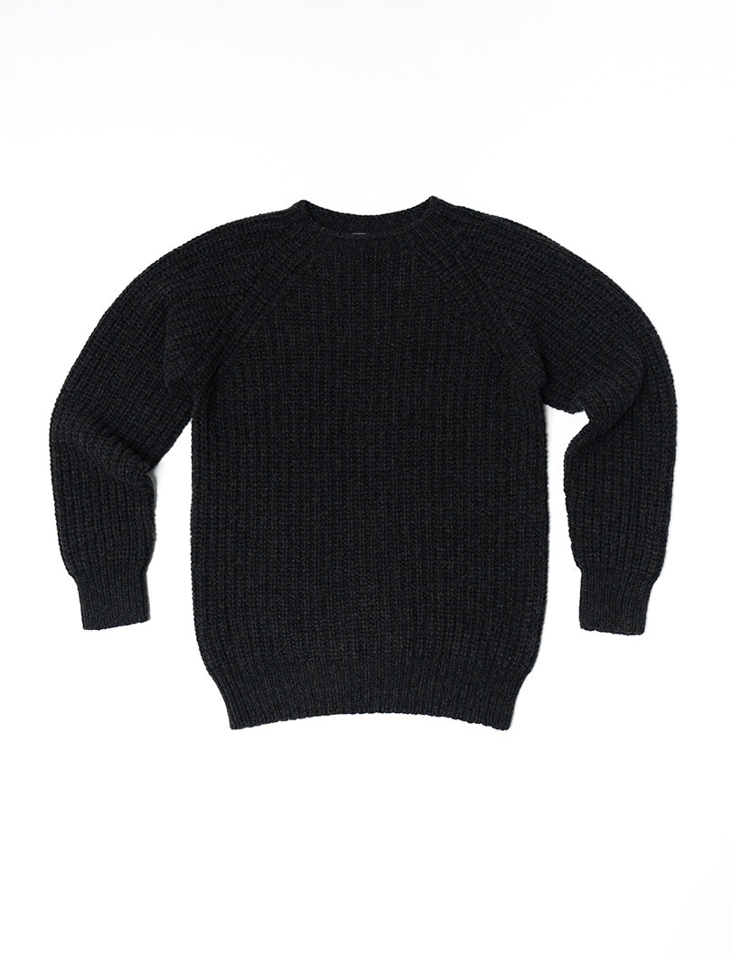 A charcoal gray fisherman's ribbed jumper with long sleeves and a round crew neckline.