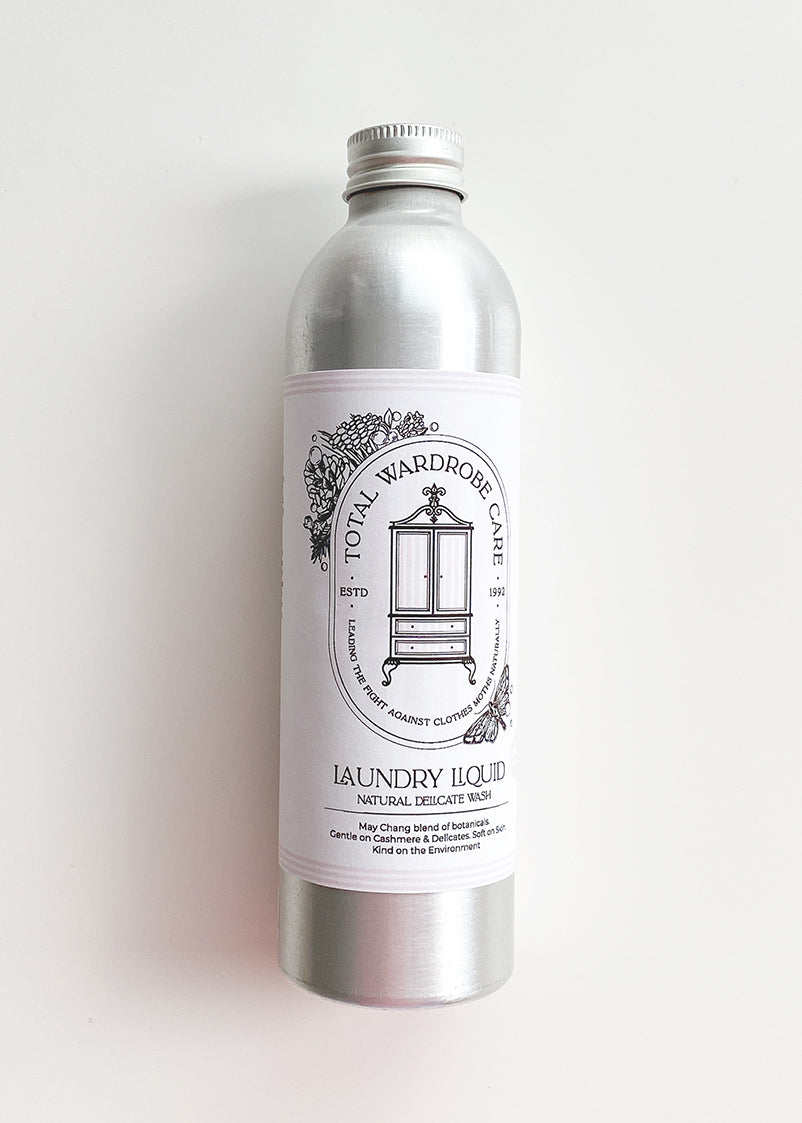 Silver bottle of natural wool wash on a white background