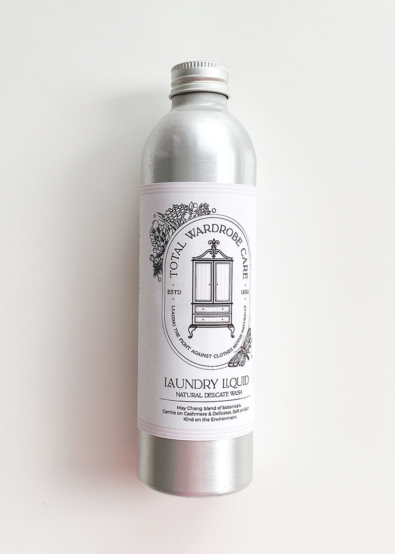 Silver bottle of natural wool wash on a white background