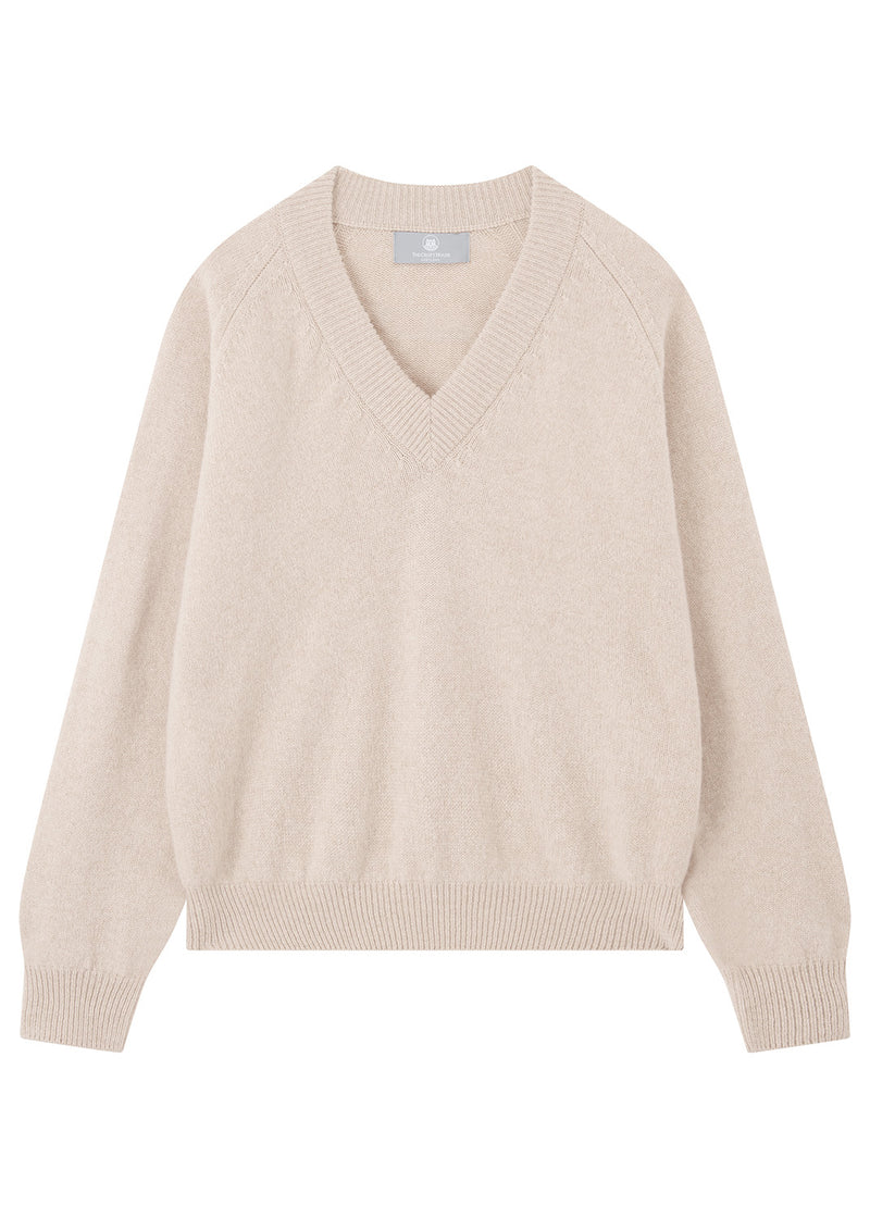 A light beige knit V-neck sweater with raglan sleeves, ribbed collar, cuffs, and hem, displayed flat against a white background.