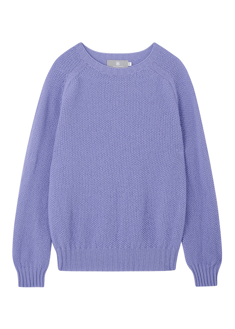 Lilac moss stitch wool sweater on a white background