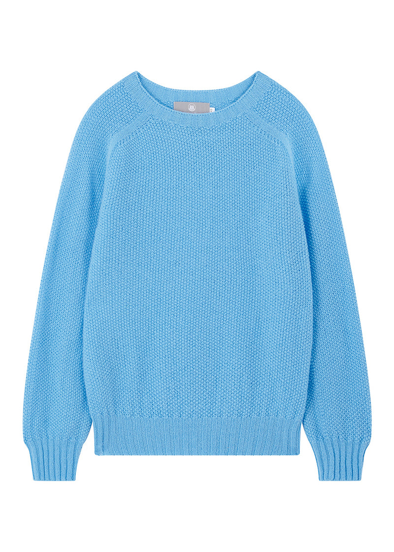 Sky blue moss stitch wool sweater on a white background