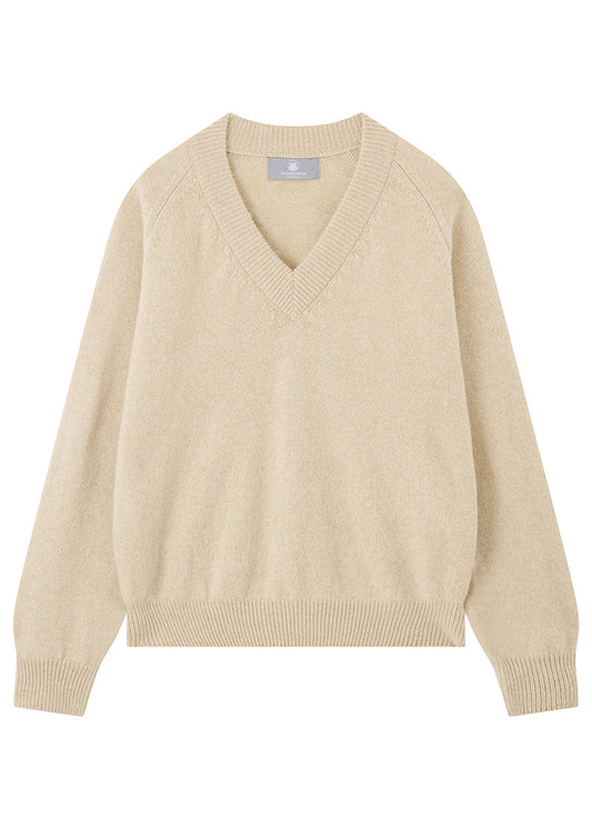 Beige sweater on a white background