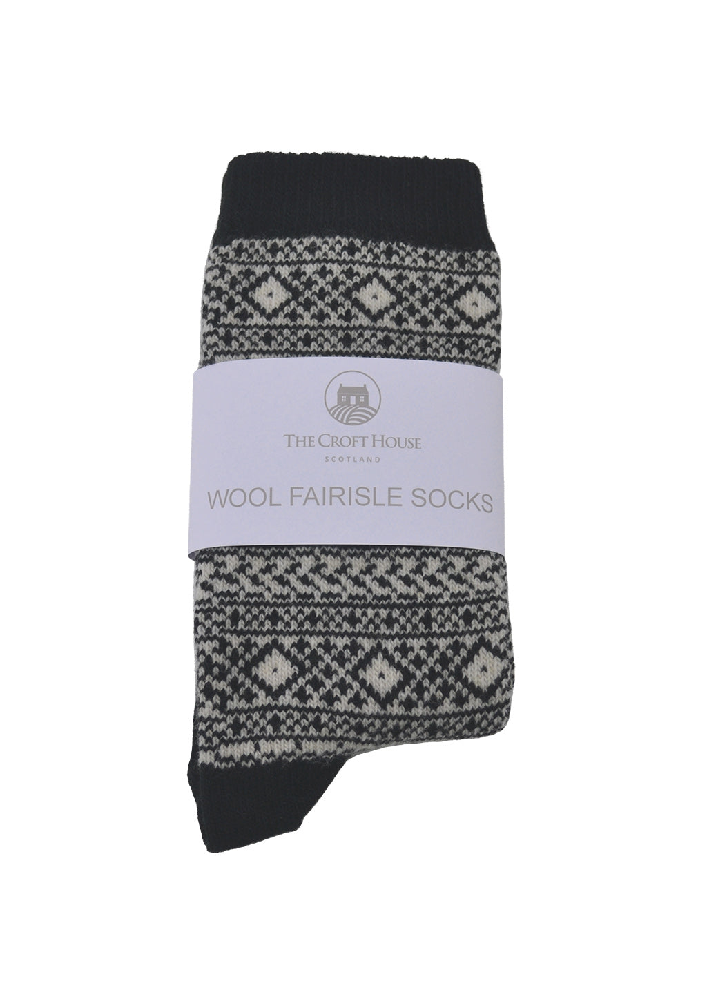 A pair of black and beige wool fair isle socks folded with a white packaging band on a white background