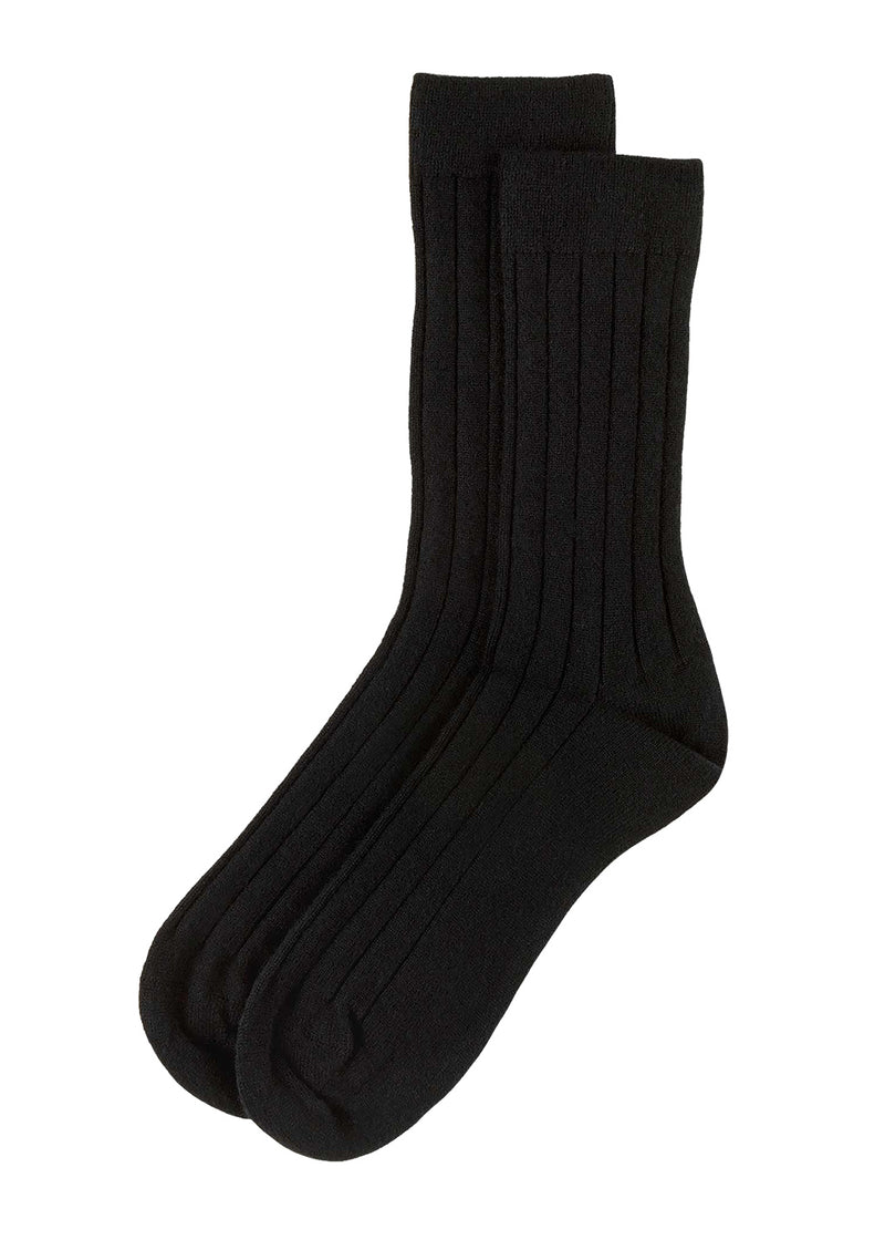 A pair of knitted mens black ribbed cashmere socks on a white background