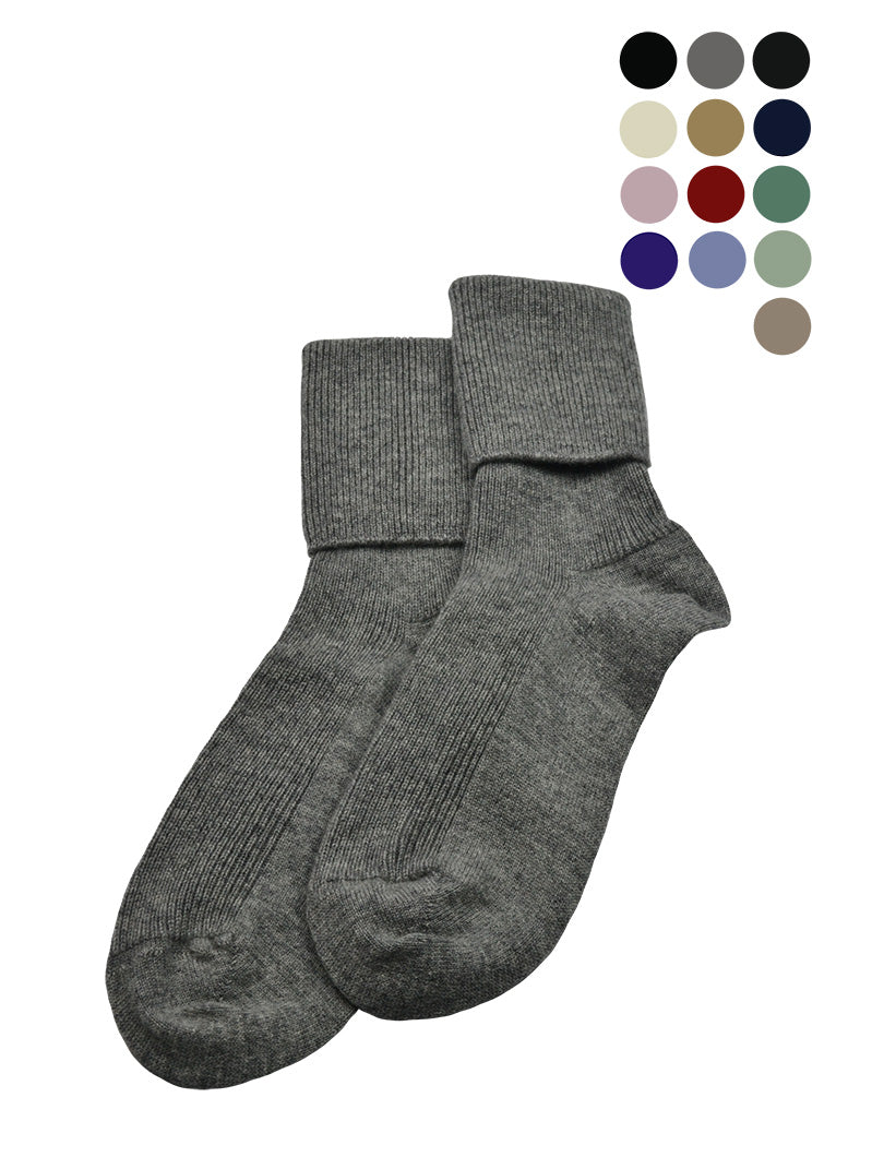 A pair of women's cashmere socks in gray, displayed alongside color swatches indicating available color options including black, ivory, camel, brown, gray, pink, navy blue, lavender, purple, red, and green.